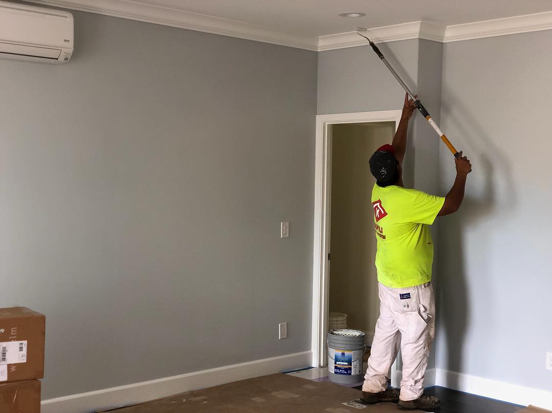 Kapili Painting crew working on a commercial building exterior in Oahu