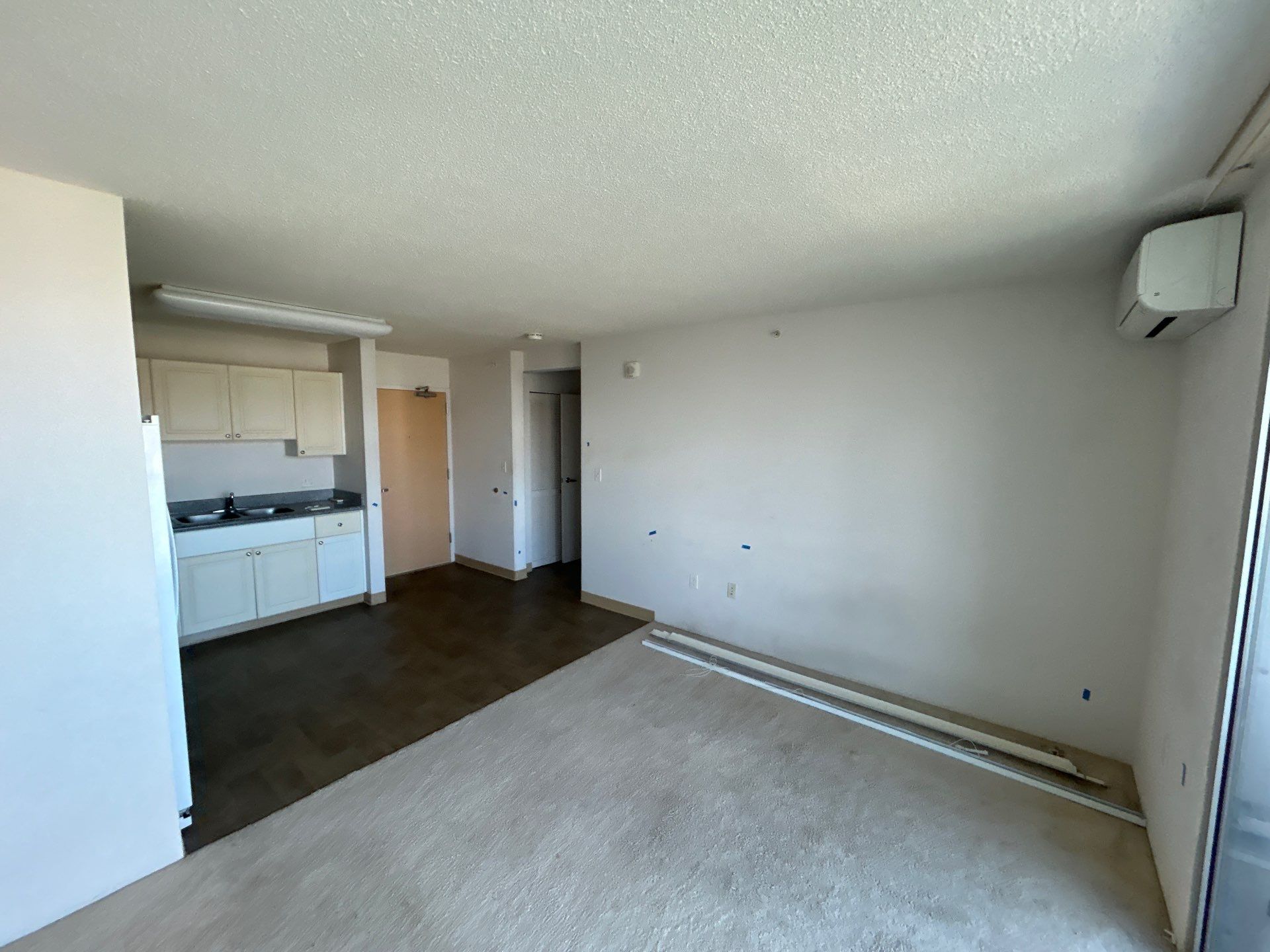 Interior room prepared with floor protection before painting in Oahu