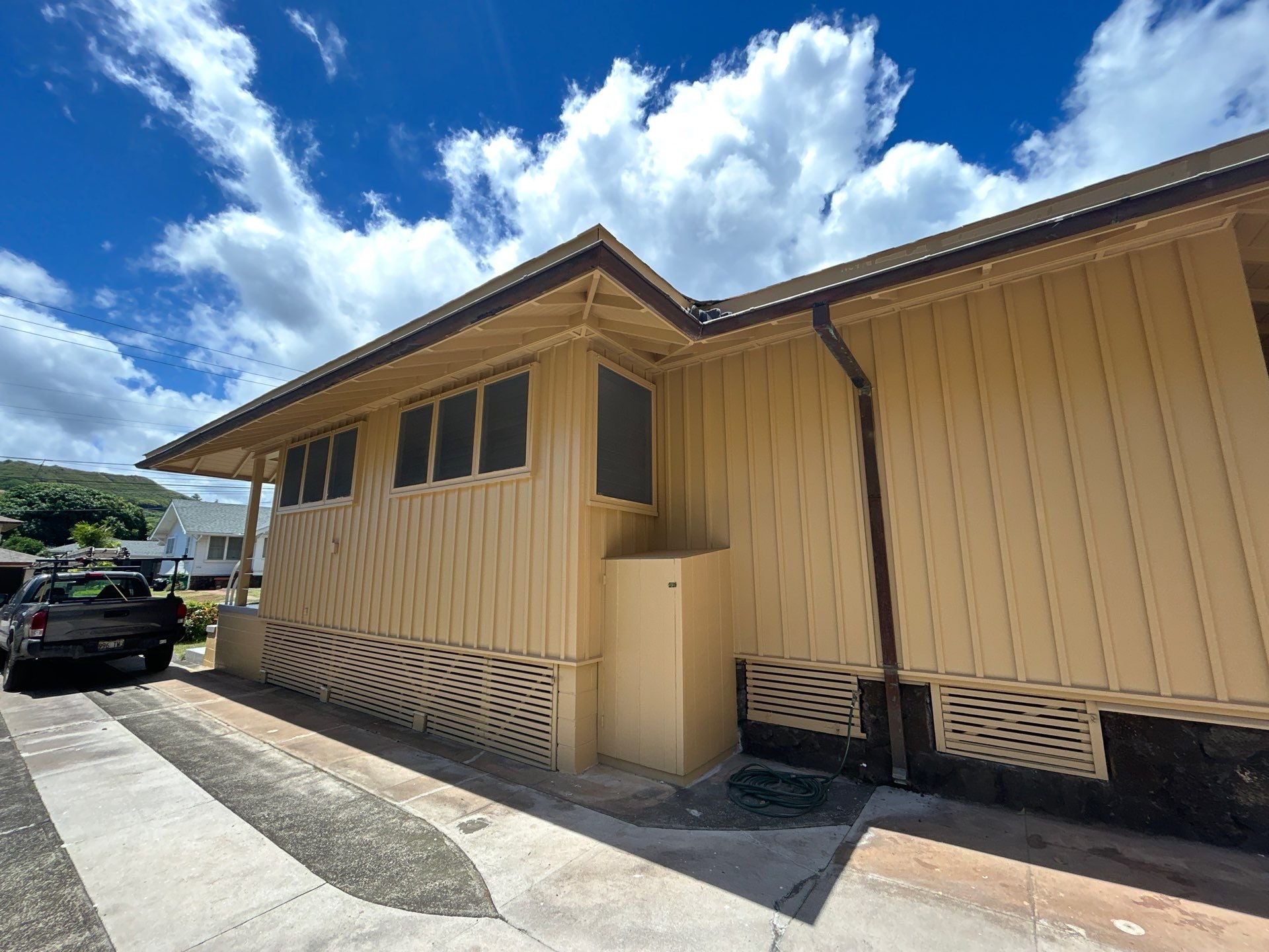 Single-story home with repainted tan exterior and carport in Wahiawa, Oahu