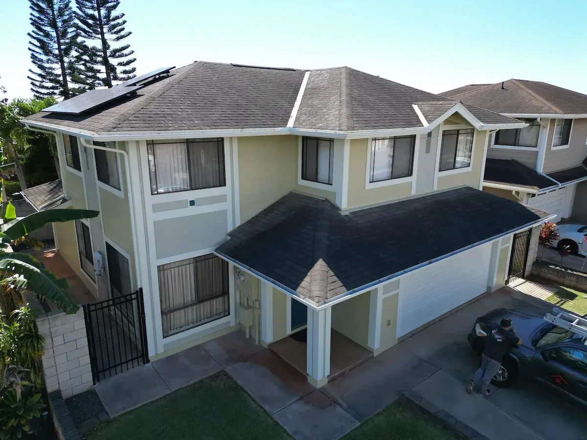 Two-story home with repainted cream exterior and gated entry in Mililani, Oahu